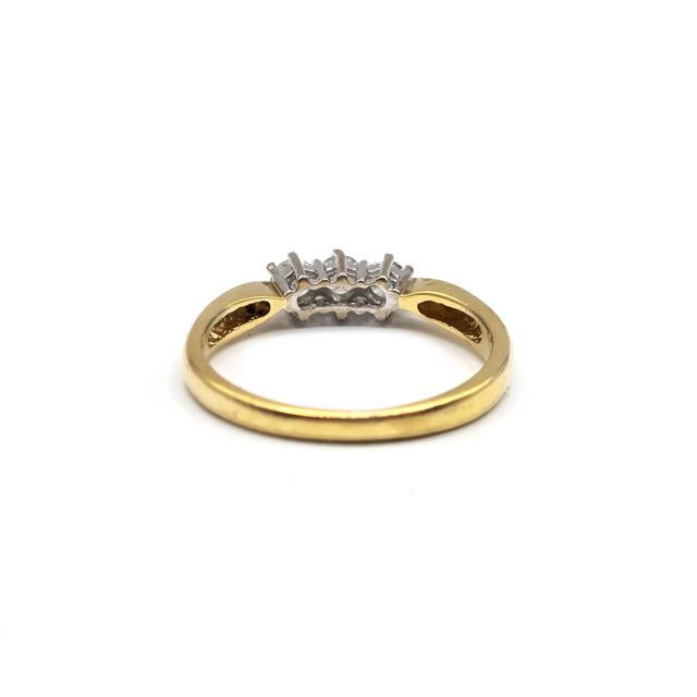 18ct yellow gold three-diamond ring with a sleek band, showcasing sparkling diamonds set in a classic style.