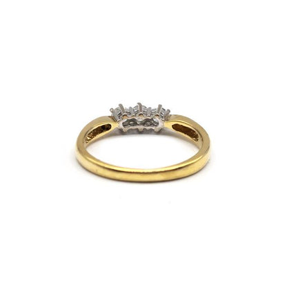 18ct yellow gold three-diamond ring with a sleek band, showcasing sparkling diamonds set in a classic style.