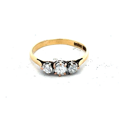 18ct yellow gold three diamond ring in size L, featuring a classic design with sparkling diamonds on a sleek gold band.