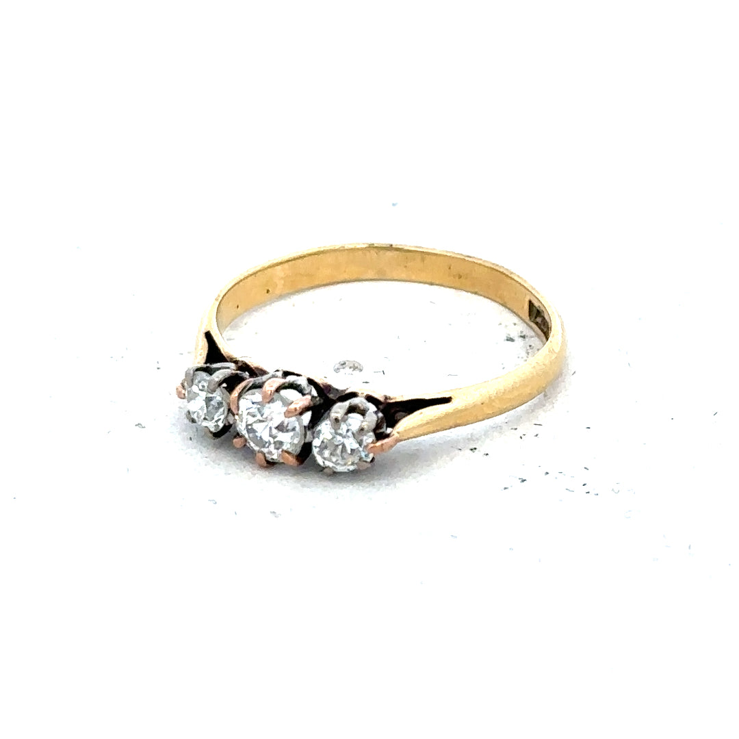18ct yellow gold three diamond ring in size L with a classic design and sparkling diamonds.