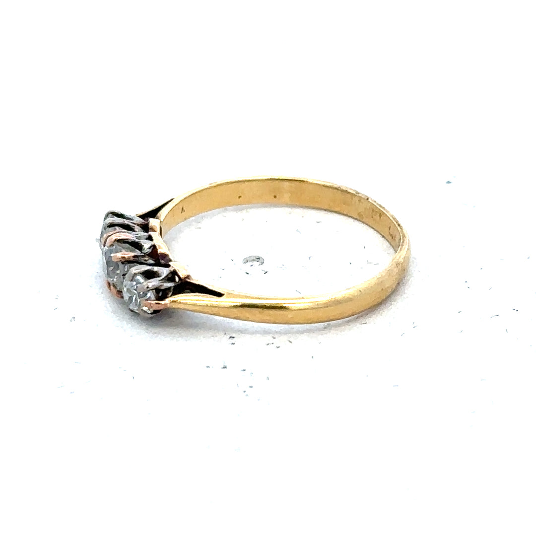 18ct yellow gold three diamond ring in size L, featuring a elegant design with sparkling diamonds on a polished band.