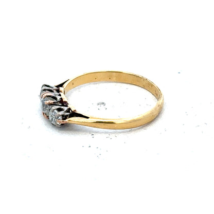 18ct yellow gold three diamond ring in size L, featuring a elegant design with sparkling diamonds on a polished band.