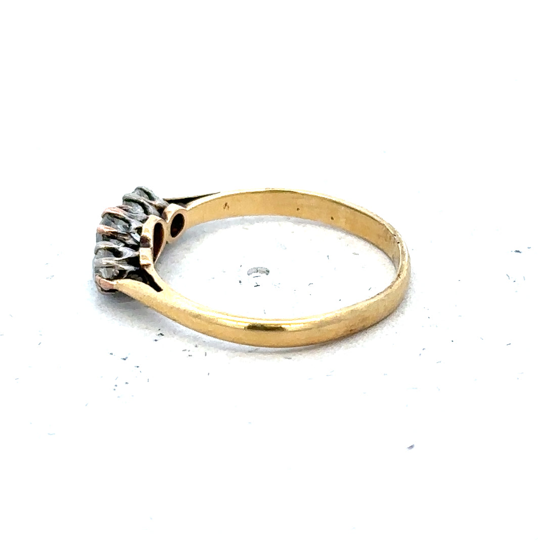 18ct yellow gold three diamond ring in size L, featuring a classic design with sparkling diamonds on a sleek band.