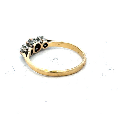 18ct yellow gold three diamond ring in size L, featuring a classic design with sparkling diamonds and a polished gold band.