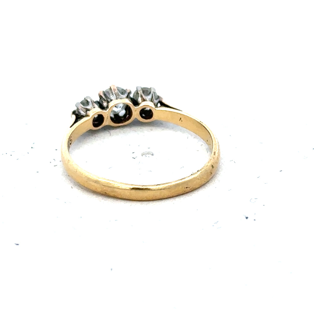 18ct yellow gold three diamond ring in size L, featuring a classic design with sparkling diamonds on a polished band.