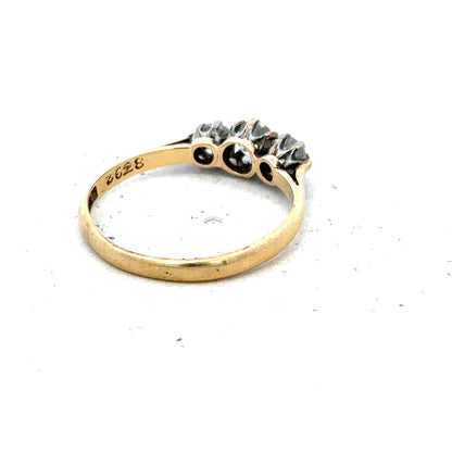 18ct yellow gold three diamond ring in size L, featuring a sleek band with sparkling diamonds, unbranded jewelry piece.