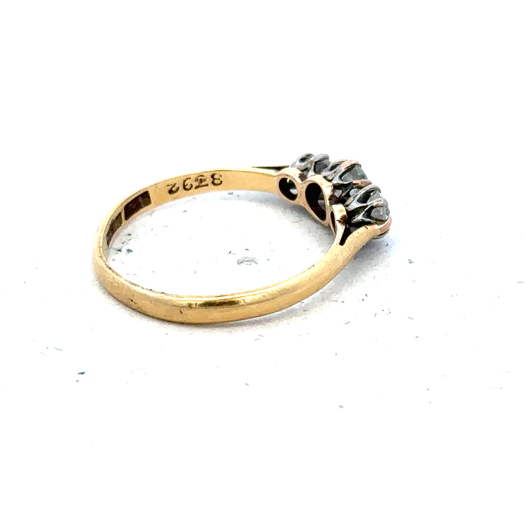 18ct yellow gold three diamond ring in size L, featuring a sleek band and sparkling diamonds, unbranded jewelry accessory.