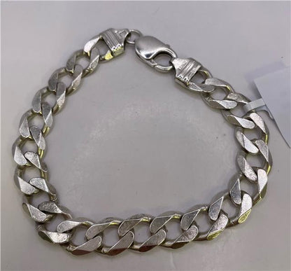 Sterling silver bracelet with intricate design, unbranded, featuring polished links and detailed craftsmanship.
