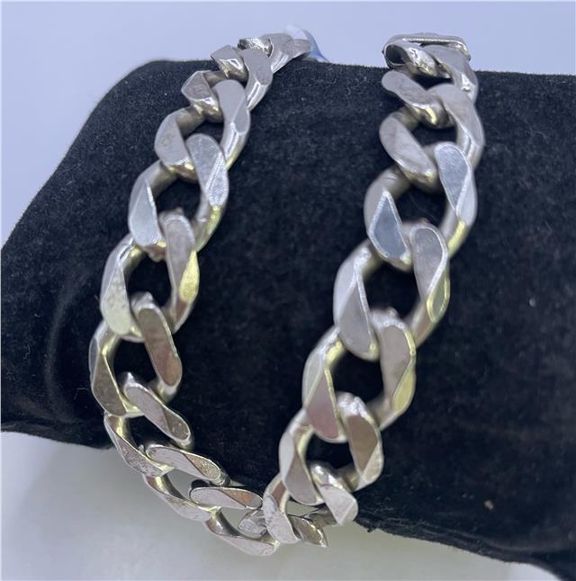 925 silver bracelet with intricate design, unbranded jewelry piece, shiny polished finish, displayed on a neutral background.