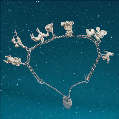 925 silver charm bracelet with intricate charms, unbranded, weighing 27.3 grams, designed for stylish, everyday wear.