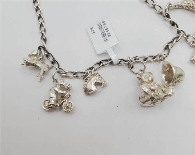 925 silver charm bracelet with delicate charms, weighs 27.3g, unbranded jewelry accessory featuring detailed silver design.