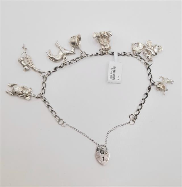 925 silver charm bracelet with intricate designs, weighing 27.3g, featuring a classic unbranded style in the image.