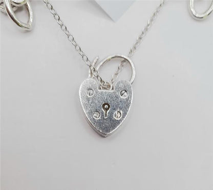 925 silver charm bracelet, 7-inch unbranded jewelry with detailed charms, weighs 53.6g, stylish and elegant accessory.
