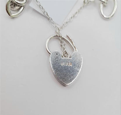 925 silver charm bracelet, 7-inch unbranded jewelry with intricate detailing and lightweight design, weighs 53.6 grams.