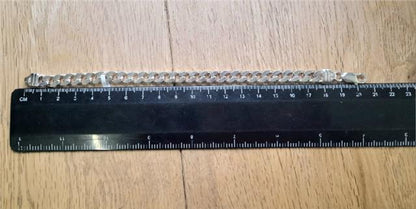 925 silver curb bracelet weighing 26g and measuring 20.5cm, showcasing a sleek, polished silver jewelry design.