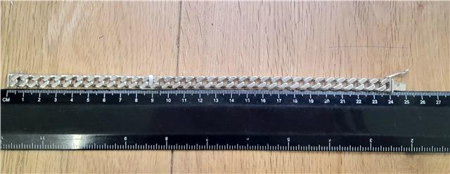 925 silver curb bracelet weighing 37.9g and 24cm long, featuring a classic silver jewelry design.