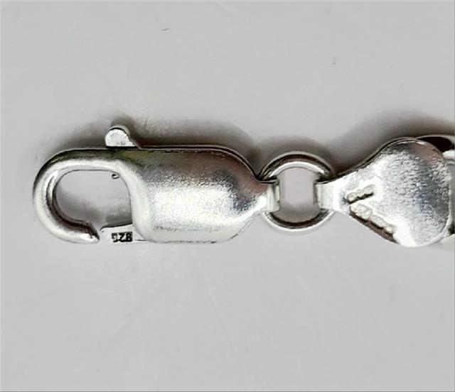 925 silver Figaro chain, 18-inch length, 37.7g, unbranded, detailed close-up showing polished links and craftsmanship.