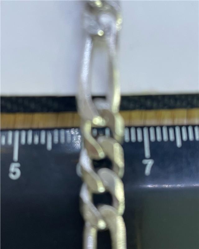 925 silver Figaro chain with intricate links, showcasing a sleek and polished design, ideal for everyday wear.