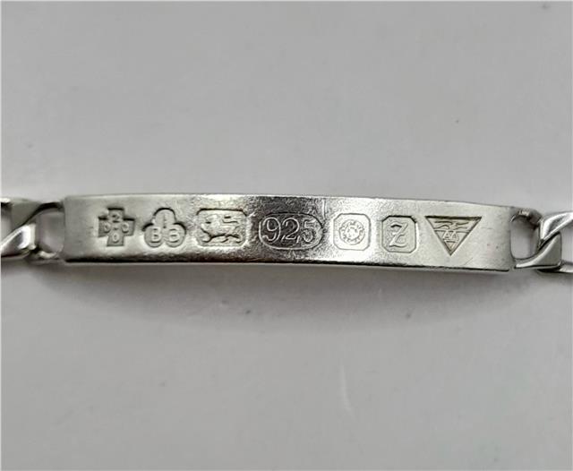 925 silver ID bracelet with an 8.2-inch length and 18.4g weight, featuring a sleek, polished design on a plain silver bracelet.