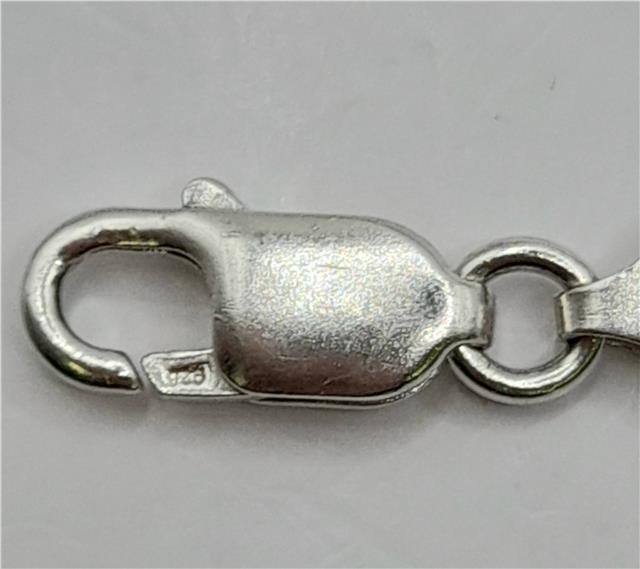 925 silver ID bracelet, unbranded, 8.2 inches long, weighs 18.4g, featuring a sleek silver design and adjustable fit.