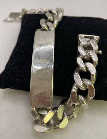 925 silver ID bracelet with adjustable chain and engraved plate, featuring a sleek and polished finish.