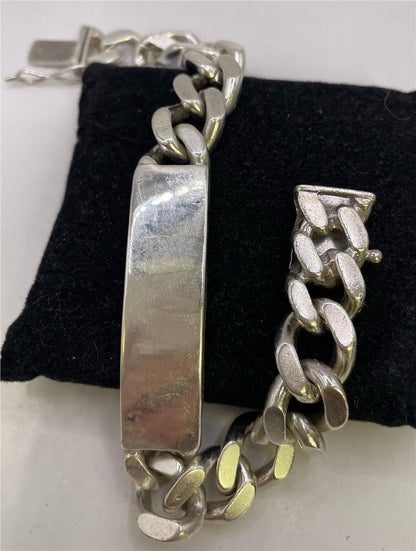 925 silver ID bracelet with engraved plate, unbranded jewelry featuring a sleek, polished silver finish and adjustable chain.