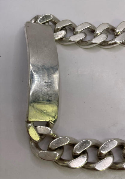 925 silver ID bracelet with engraved plate, unbranded jewelry, showcasing a sleek, polished silver design on a white background.