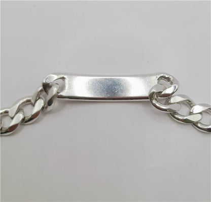 925 silver ID curb bracelet, 22cm length, unbranded, featuring a sleek silver chain with an ID plate, on a plain background