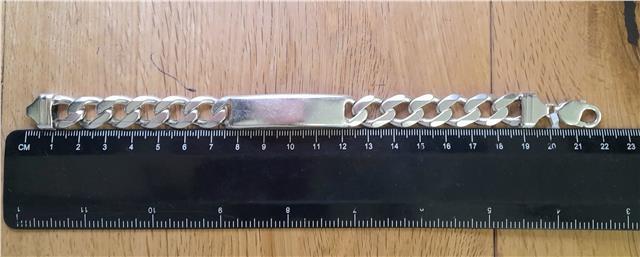 925 silver ID curb bracelet, 22cm length, unbranded, with a sleek silver chain and ID plate, displayed on a neutral background.