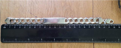 925 silver ID curb bracelet, 22cm length, unbranded, with a sleek silver chain and ID plate, displayed on a neutral background.