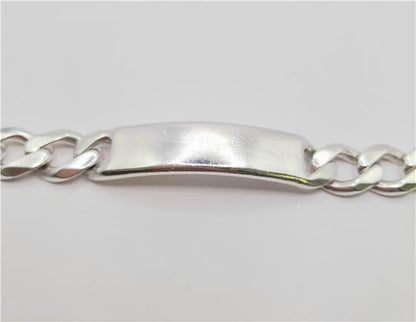 Silver ID curb bracelet made of 925 sterling silver, 22cm length, with a sleek chain design.
