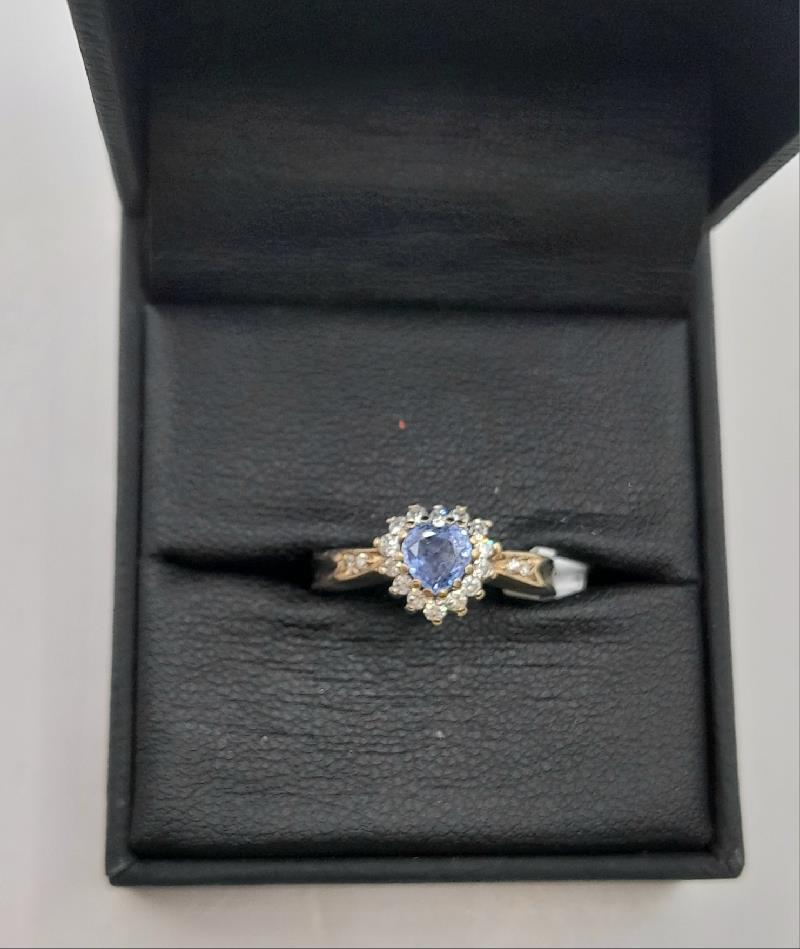 9ct diamond ring in size J1/2 with 2.8g, showcasing a sparkling diamond and elegant band design.