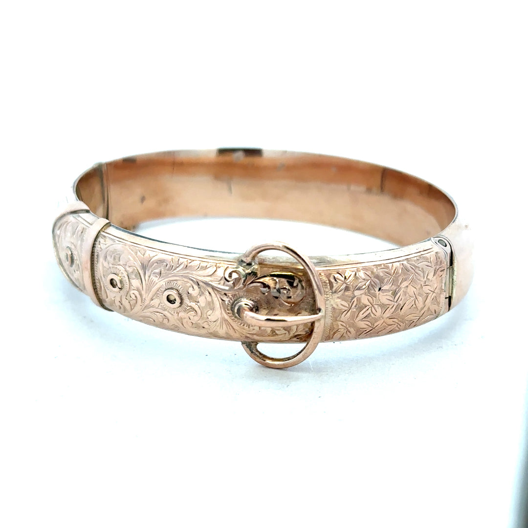 9ct gold bangle weighing 17.9g, unbranded, with a smooth polished finish, displayed on a neutral background.