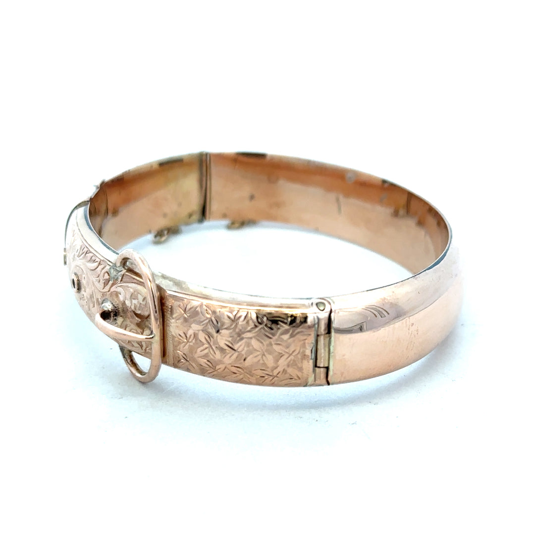 9ct gold bangle weighing 17.9g, unbranded, with a smooth polished finish, shown on a plain background.