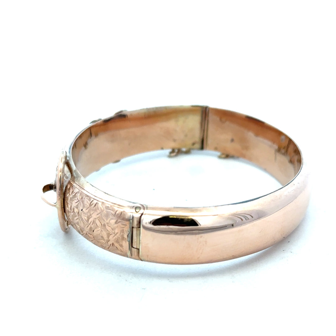 9ct gold bangle weighing 17.9g, unbranded, showcasing a smooth, polished finish with a simple, elegant design.