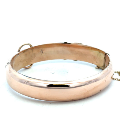 9ct gold bangle weighing 17.9g, featuring a smooth, polished finish, perfect for elegant jewelry styling.