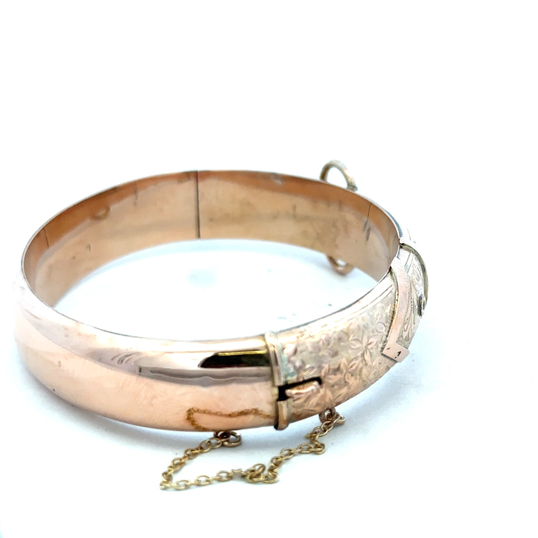 9ct gold bangle weighing 17.9g, unbranded, featuring a sleek, polished design perfect for elegant jewelry collection.