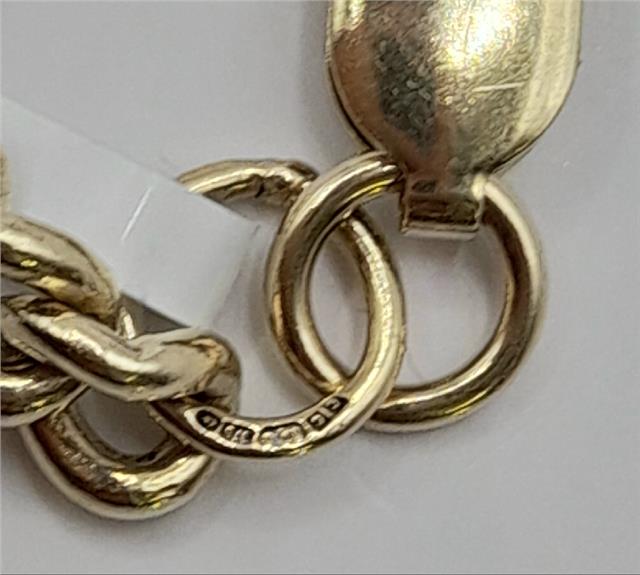 9ct gold bracelet weighing 12.6g and measuring 21cm, displayed on a neutral background, showcasing its elegant design.
