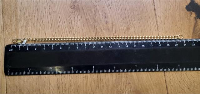 9ct gold bracelet weighing 12.6g and measuring 21cm, featuring a sleek, polished design with a secure clasp.