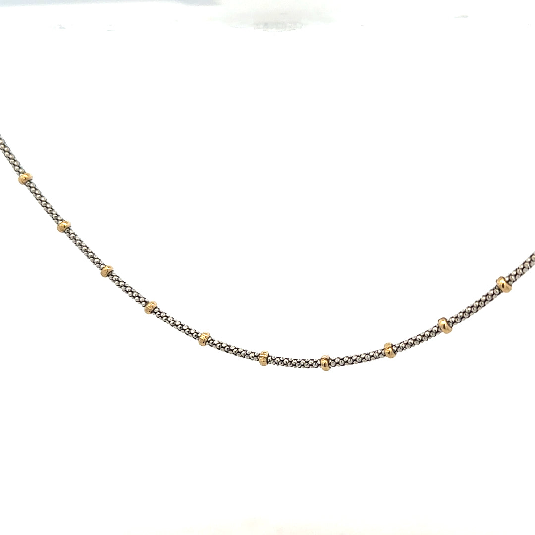 9ct gold chain weighing 5.6g, featuring a classic link design, unbranded jewelry piece with a polished finish.