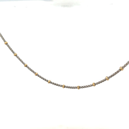 9ct gold chain weighing 5.6g, featuring a classic link design, unbranded jewelry piece with a polished finish.