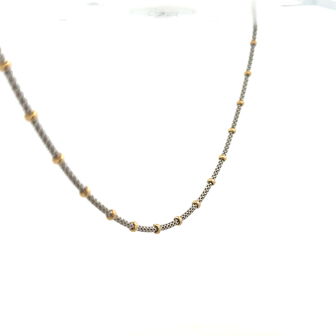 9ct gold chain weighing 5.6g, unbranded, with a detailed close-up of the elegant jewelry design and polished finish.