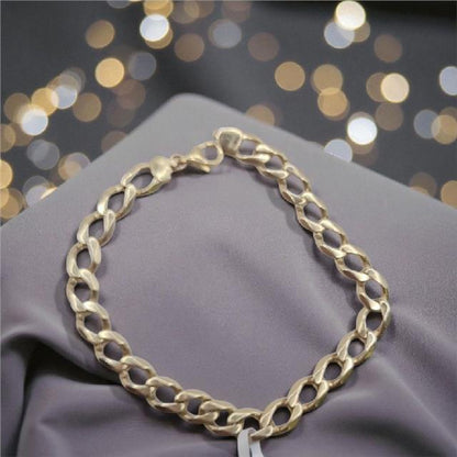 9ct gold curb bracelet, 21cm length, 12.9g, unbranded, with detailed chain links, displayed on a neutral background.