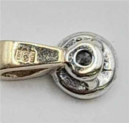9ct gold diamond pendant with sparkling diamonds, weighs 0.7g, featuring a classic design, unbranded jewelry piece.