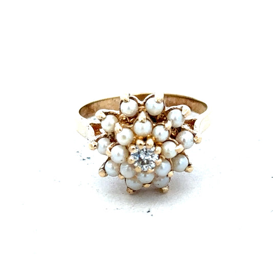 9ct gold diamond ring with a central sparkling diamond, showcasing elegant craftsmanship and a polished gold band.