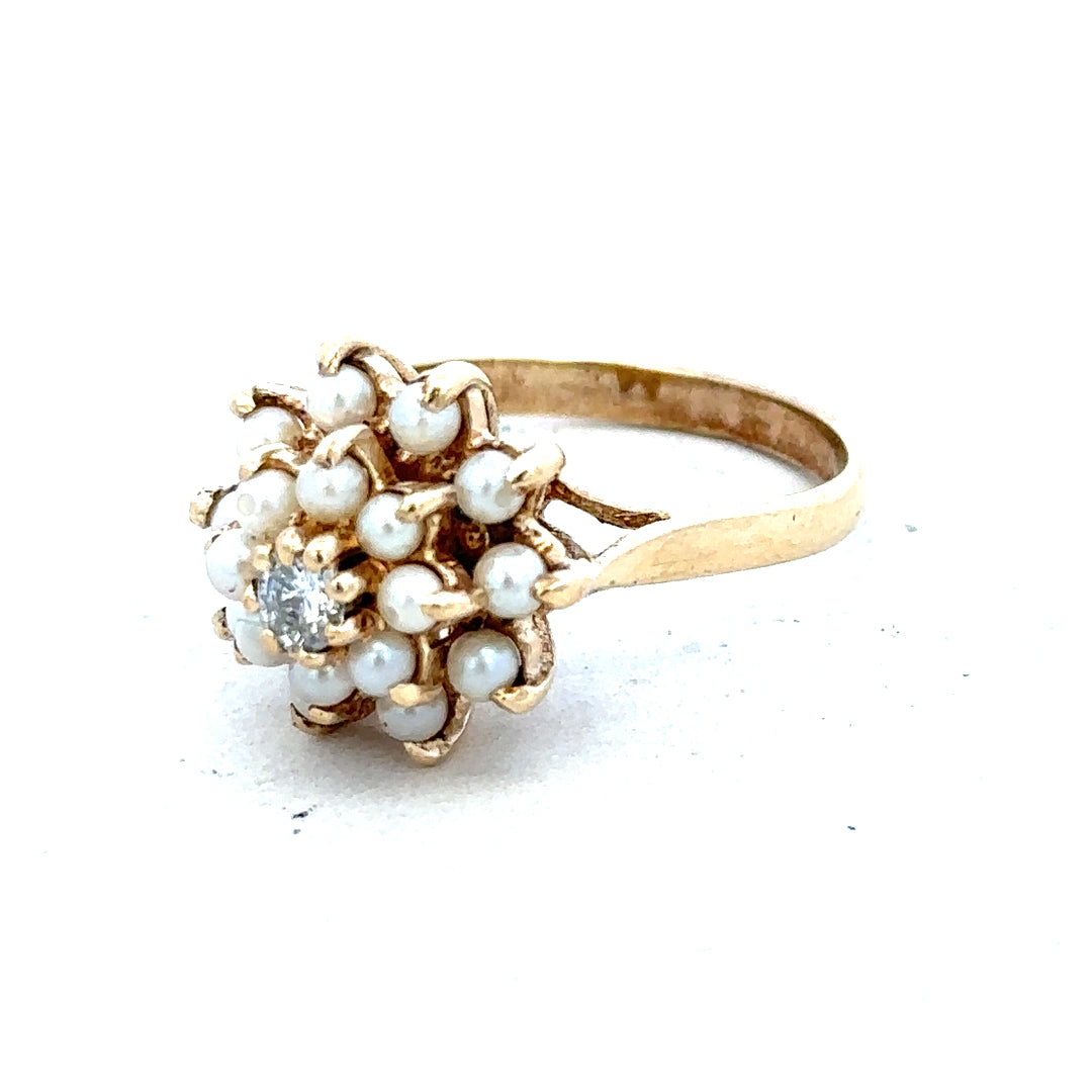 9ct gold diamond ring with a sparkling central diamond and elegant band, showcasing fine craftsmanship and timeless design.
