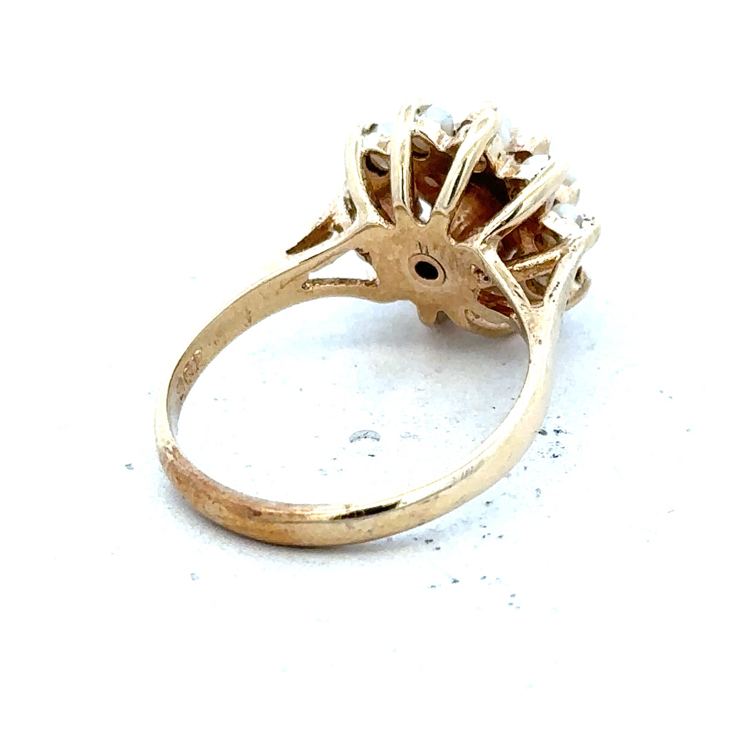 9ct gold diamond ring with a solitaire diamond and a polished band, showcasing elegant jewelry craftsmanship.