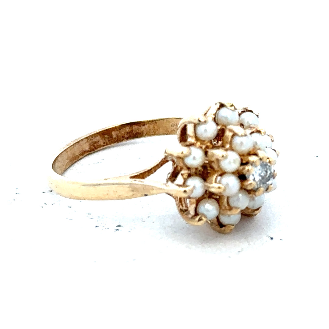 9ct gold diamond ring featuring a sparkling central diamond set in a classic gold band.