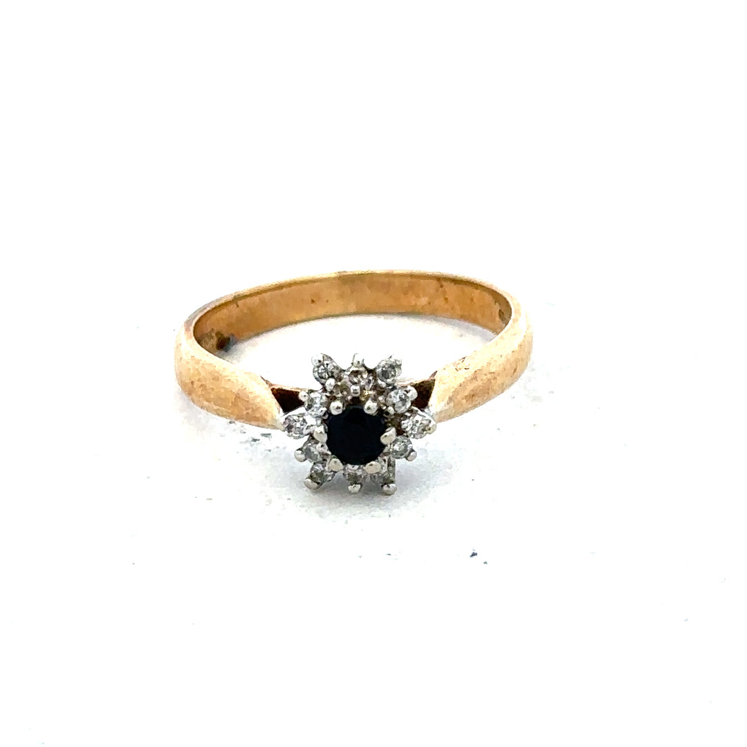 9ct gold diamond ring with a sparkling central diamond and elegant band, showcasing fine craftsmanship and timeless style.