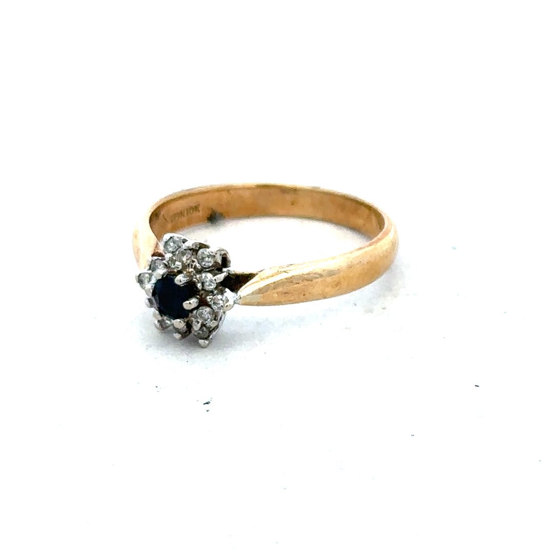 9ct gold diamond ring with a central sparkling diamond and a polished gold band, showcasing elegant fine jewelry design.